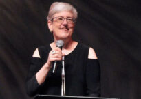 Debra Cash at podium
