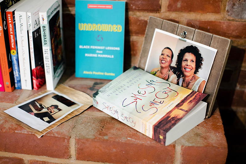 A handful of books on a brick table